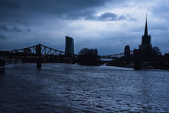 View after sunset to the Iron Bridge in Frankfurt am Main with back-light of the twilight