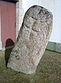 Menhir christianisé près de l'église paroissiale Notre-Dame de Trogwall.