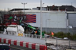 Construction workers doing something with a Cemblend truck along the A63, photographed from the Porter Street Bridge in Kingston upon Hull.