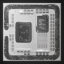 A de-lidded Ryzen 5 5600X. Only one CCD is present. The contacts for a second CCD are visible.