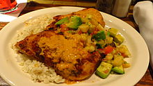 Chicken with Ajilimojili, rice, and salsa Ajilimojili Chicken (9373907910).jpg