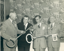 Albert H. Tinnerman left, at the plant opening on Brookpark Road, 1950, presents keys to Mayor Thomas A. Burke right, Cleveland and to Mayor John M. Coyne far right, Brooklyn. Albert H. Tinnerman, inventor of the Speed Nut.png