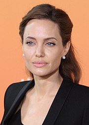 A brown haired woman looking away from the camera.