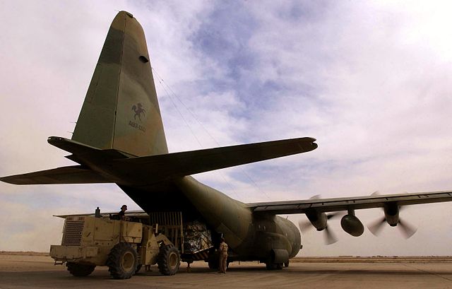 A RAAF C-130 Hercules being unloaded at Tallil Air Base, Iraq, during April 2003