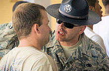 Basic Trainee at Lackland AFB being corrected by a TI with regards to a training issue. BMT - Lackland.jpg