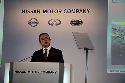 Carlos Ghosn in front of new CI at the 2013 earnings press conference in Yokohama.