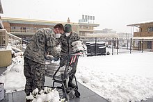 Members of the Colorado Air National Guard delivering meals to people staying in a motel in Denver. Colorado National Guard - 49783083472.jpg