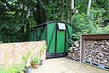 A disused goods wagon at Droxford, 2016. Following the station closure, British Rail used the site to store wagons of this type awaiting scrapping. Droxford Station (28061084965).jpg