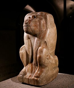 Crude stone statue of a baboon