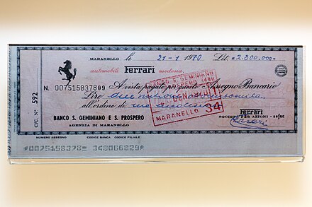 A cheque signed by Enzo Ferrari in the collection of the Museo Ferrari, showing CMC-7 markings.