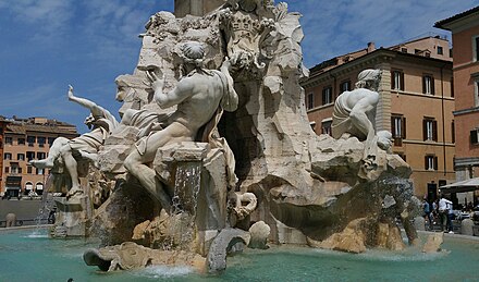 The splashing water of the Fontana dei Quattro Fiumi (1648-1651, Gian Lorenzo Bernini), situated in the centre of Piazza Navona, on an early summer day Fontana dei Quattro Fiumi (Roma, Piazza Navona).jpg