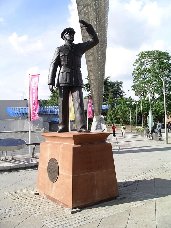 Statue in Coventry, England of Sir Frank Whittle observing the first British jet-powered flight