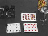 The game Gin Rummy is mentioned in the last track of the album as a metaphor for the powerful men of the world. Gin Rummy.jpg