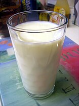 Glass of milk on tablecloth.jpg