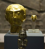 The two hollow heads, with the statuette perhaps of a king in front