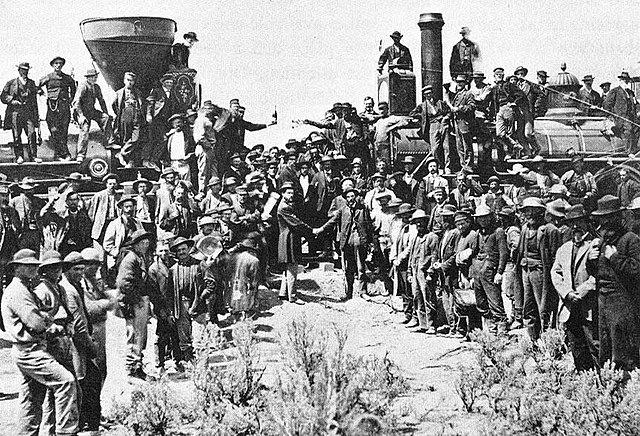 The golden spike is driven at Promontory Summit, Utah, on the First Transcontinental Railroad in North America in 1869.