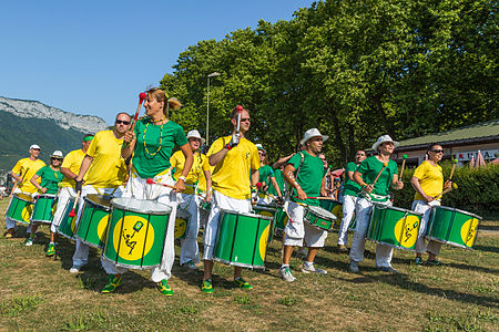 Group Tribal Percussion marching in Annecy (France) playing Brazilian percussion: the Batucada.