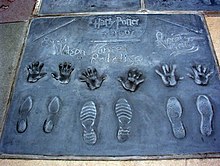Radcliffe, Grint, and Watson were honored outside Grauman's Chinese Theatre at the Hand, Foot, and Wand Ceremony, Hollywood Walk of Fame, July 2007. Harry Potter cast.jpg