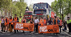 Just Stop Oil Activists Walking Up Whitehall.jpg