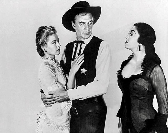 Jurado (black dress) Grace Kelly and Gary Cooper in High Noon (1952)
