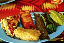 Indonesian snacks, such as tahu isi, pisang goreng, risoles, timpan, lemper, and kue pisang. Kue di Bandar Udara Sultan Iskandarmuda.jpg