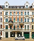 Apartment building in closed development, with shops