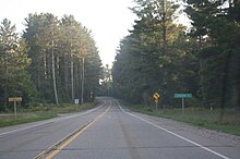 Looking south while entering Langlade County on WIS 55. LangladeCountyWisconsinSign2009WIS55.jpg