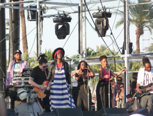 Hill and her backing musicians performing at the Coachella Valley Music and Arts Festival, 2011 Lauryn Hill 2011.png