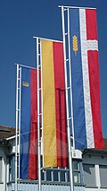 When flown vertically, the crown on the flag is rotated so that it always faces upwards. Liechtenstein schaan flags 2009-08-15.jpg