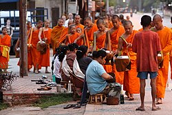 Monks collecting alms at dawn in Luang Prabang