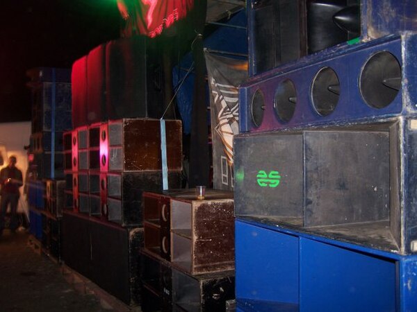 A huge bank of speakers and subwoofers from a rave sound reinforcement system