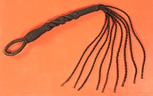 Nineteenth-century cat o' nine tails,
.mw-parser-output .frac{white-space:nowrap}.mw-parser-output .frac .num,.mw-parser-output .frac .den{font-size:80%;line-height:0;vertical-align:super}.mw-parser-output .frac .den{vertical-align:sub}.mw-parser-output .sr-only{border:0;clip:rect(0,0,0,0);clip-path:polygon(0px 0px,0px 0px,0px 0px);height:1px;margin:-1px;overflow:hidden;padding:0;position:absolute;width:1px}
97 centimetres (38+1/4 in) long, composed of nine lengths (approximately 46 centimetres or 18 inches) of tarred, braided hemp with ends lashed. Nineteenth-century U.S. Navy cat o' nine tails.jpg