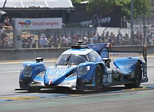 IDEC Sport's Delage-backed Oreca 07 at the 2023 24 Hours of Le Mans. Oreca 07 - Paul Lafargue, Paul-Loup Chatin & Laurents Horr exit Dunlop Chicane at the 2023 Le Mans (53366664996).jpg