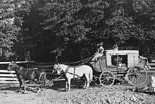 Mud-wagon Photograph of a stage coach. The coach is a "mudwagon" used to travel through rugged terrain. - NARA - 296584 (cropped).jpg