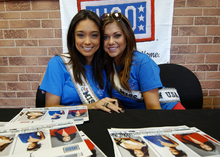 Smith and Hilary Cruz signing autographs at Kadena Air Base in Japan RachelHilaryUSO.png