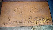 Jackson's handprints in front of Mickey & Minnie's Runaway Railway at Walt Disney World's Disney's Hollywood Studios theme park Samuel L. Jackson (handprints and signature in cement).jpg