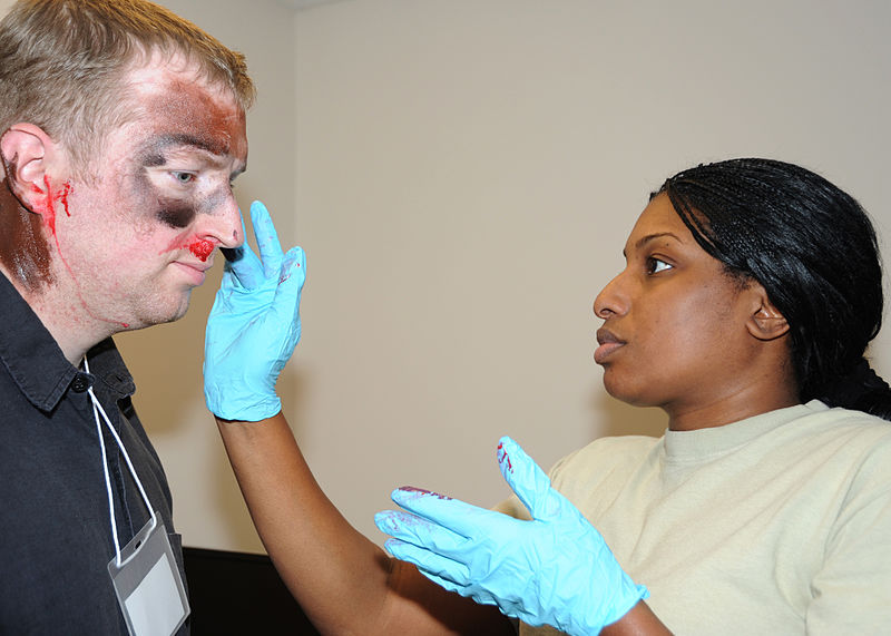 File:Senior Airman Lisa Sam applies makeup to North Carolina CAP cadet.JPG