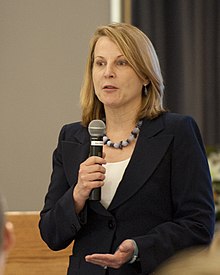 Alice Hill speaking in 2012 Senior Executive Leadership Meeting 120508-G-VS714-094.jpg