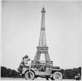 Soldiers of the 4th U.S. Infantry Division look at the Eiffel Tower in Paris, after the French capital had been... - NARA - 535757.tif