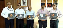 http://upload.wikimedia.org/wikipedia/commons/thumb/a/ad/The_Chairman%2C_ISRO%2C_Shri_A.S._Kiran_Kumar_releasing_the_Mars_Atlas_on_the_occasion_of_the_completion_of_one_year_of_Mars_Orbiter_Mission_in_Orbit%2C_in_Bangalore._The_Scientific_Secretary%2C_ISRO%2C_Dr._Y.V.N._Krishnamoorthy.jpg/220px-thumbnail.jpg