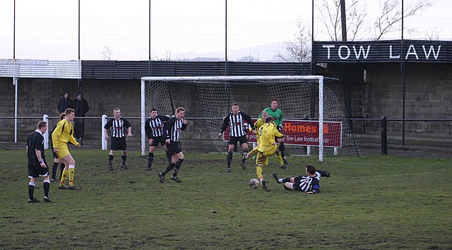 Tow Law Town (black and white stripe shirts) playing Whitley Bay in January 2009