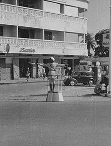 Conakry, 1956 Traffic cop in a square in downtown Conakry 1956.jpg