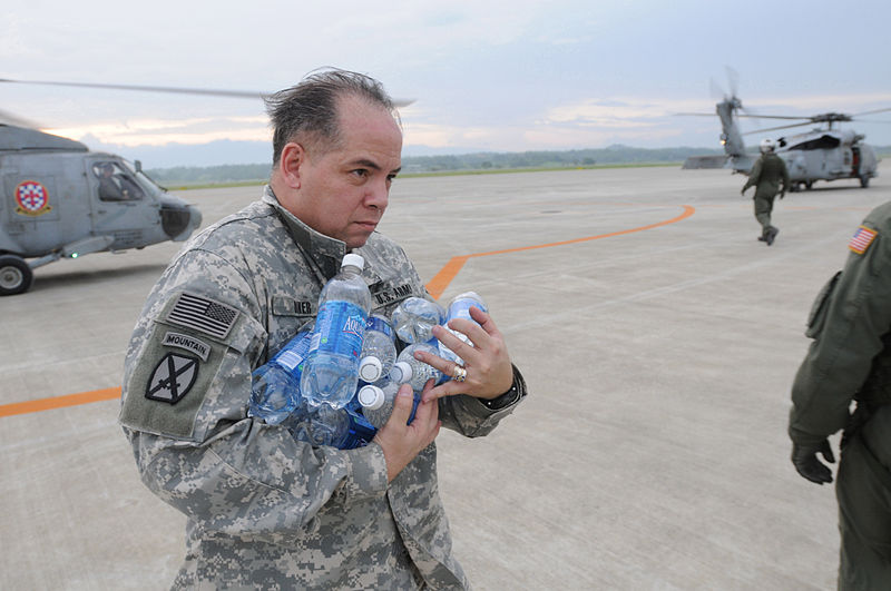 File:U.S. Army Lt. Col. Frederick Riker, deputy chief of Joint U.S. Military Assistance Group, stacks bottled water in a pile on the flight deck of USS Ronald Reagan (CVN 76) while under way in the Pacific Ocean 080625-N-HX866-004.jpg