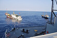 Two Chinese trawlers stop directly in front of Impeccable, forcing the ship to conduct an emergency "all stop" in order to avoid collision. USNS Impeccable-SCSea incident02.jpg