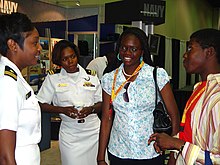 Naval recruiters talking to prospective recruits in Detroit during the 2007 Navy Week. US Navy 070708-N-2888Q-005 Lt. Ladonna Gordon (left), and Lt. Kathryn S. Wijnaldum, Recruiters in the Detroit area, talk with two high-school seniors at the 98th National Association for the Advancement of Colored People (NAACP.jpg