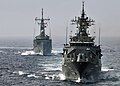 English: HMAS Sydney and HMAS Ballarat performing formation maneuvering in the Atlantic.