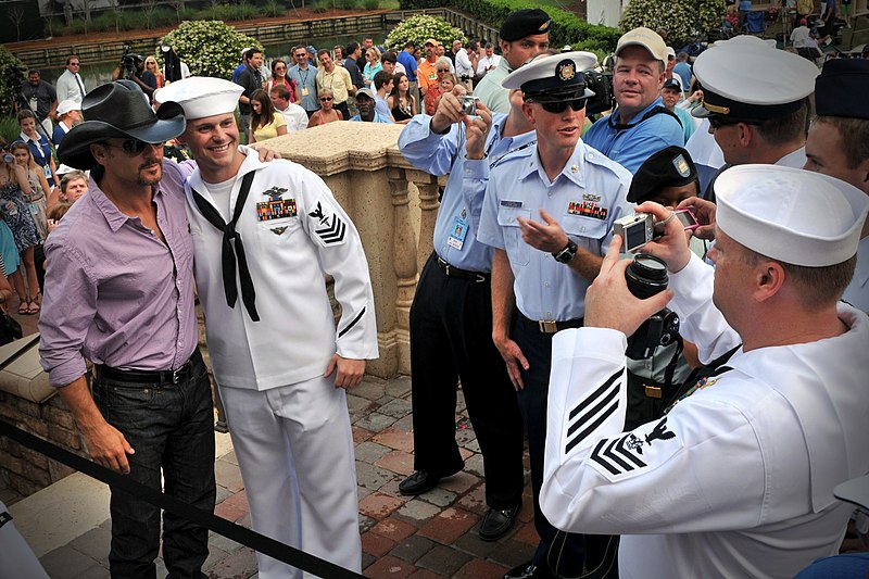 File:US Navy 100505-N-8590G-001 Country music singer Tim McGraw poses with a Sailor before performing a five-song musical tribute dedicated to the nation's military.jpg