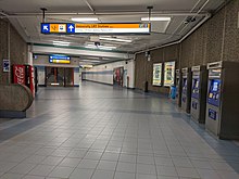 Concourse level of university station, with the ticketing machines on the right. UniversityStationConcourseJuly2020.jpg