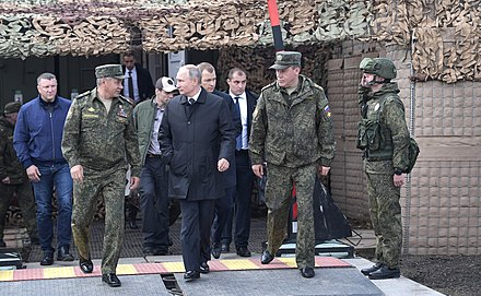 Russian President Vladimir Putin (center) meeting with Russian Defense Minister Sergey Shoygu (left) and Chief of the General Staff Valery Gerasimov  (right) at the Vostok 2018 drills
