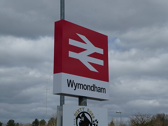 The train station sign at Wymondham, with the double arrow, the corporate identity of National Rail